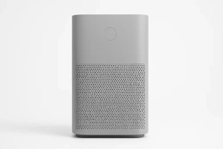 A professional studio photograph of a gray air purifier placed centrally against a white background, evenly lit and clearly showing the entire product without any text or logos.