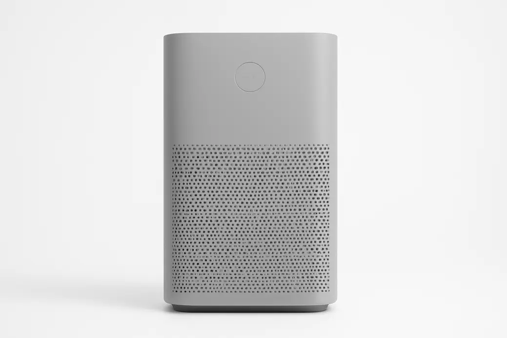 A professional studio photograph of a gray air purifier placed centrally against a white background, evenly lit and clearly showing the entire product without any text or logos.