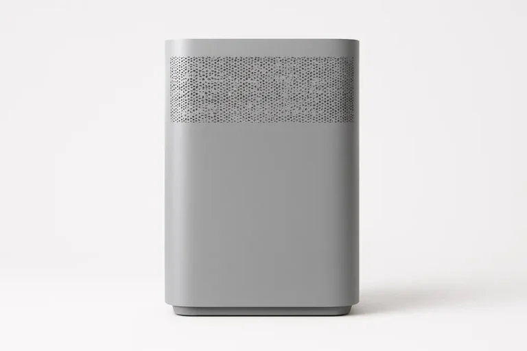 Clean product photo of a grey air purifier centered on a white background, fully visible with soft even lighting and no text or logos
