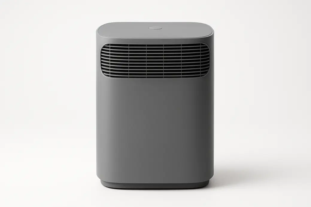 Professional product photo of a grey air purifier centered on a white background, shown fully with smooth matte plastic texture and soft even lighting