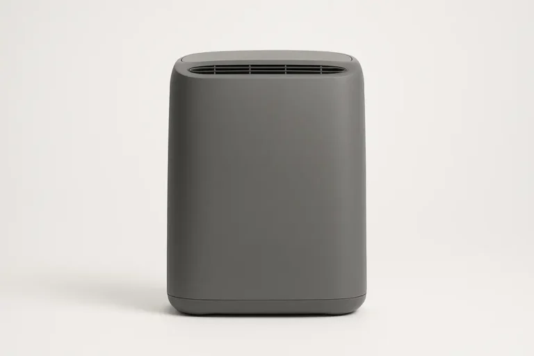 Front view of a gray air purifier centered on a white background with smooth, even lighting and a clean surface without branding or text
