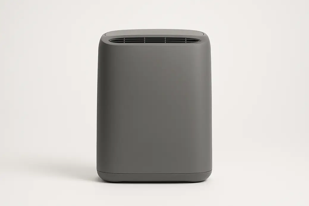 Front view of a gray air purifier centered on a white background with smooth, even lighting and a clean surface without branding or text