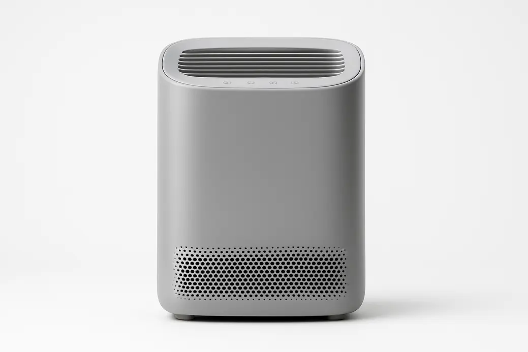 Professional product photo of a grey air purifier centered on a white background with even soft lighting, showing all details clearly and no text or logos.