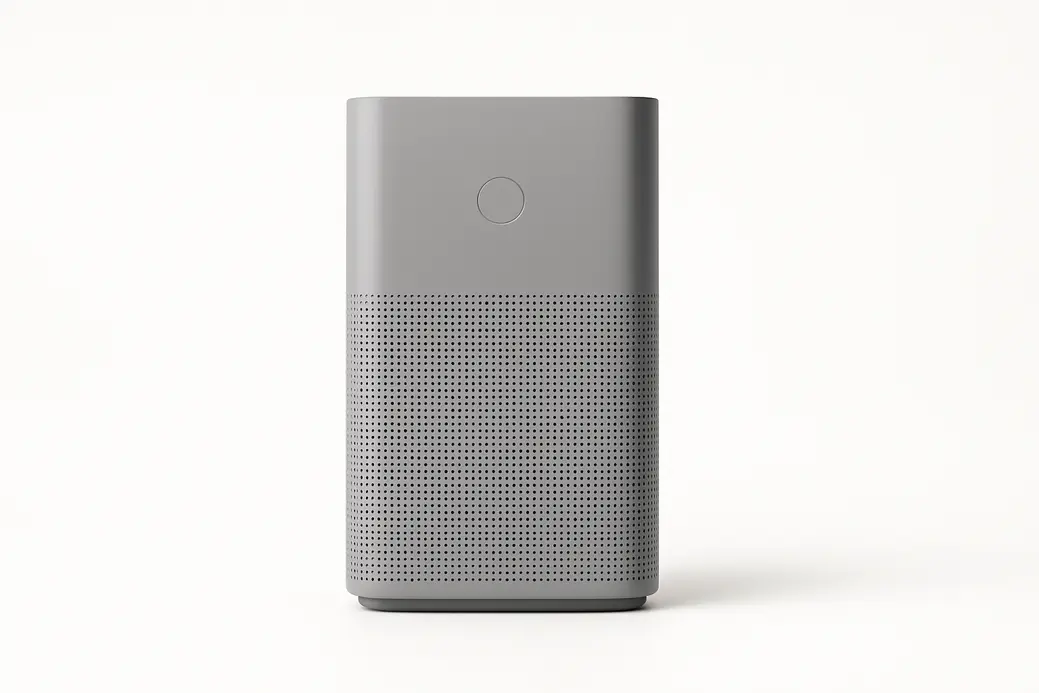 A clean product photo of a gray air purifier centered on a plain white background with soft, even professional lighting and no visible branding or text.