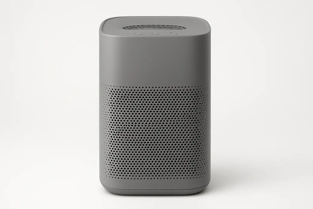 A professional product photo of a gray air purifier centered on a seamless white background with soft even lighting, showing the entire purifier clearly without any text or logos.