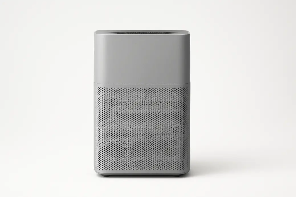 A clean, professional photo of a gray air purifier centered on a white background with soft even lighting and no visible text or branding.