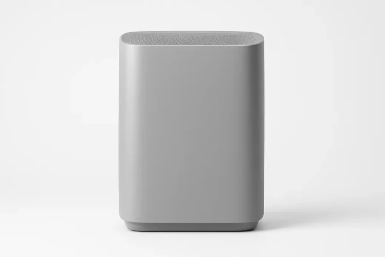 Professional product photo of a gray air purifier centered against a white background with soft, even lighting and no visible logos or text.