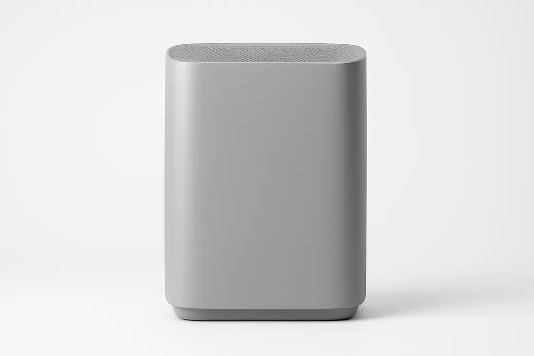 Professional product photo of a gray air purifier centered against a white background with soft, even lighting and no visible logos or text.