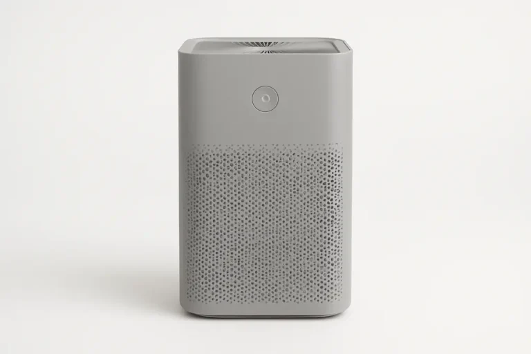 Professional product photo of a single gray air purifier centered on a clean white background with soft and even lighting
