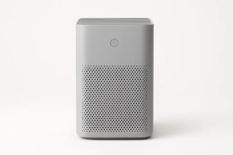 Professional product photo of a grey air purifier centered on a white background with soft even lighting and no visible text or logos.
