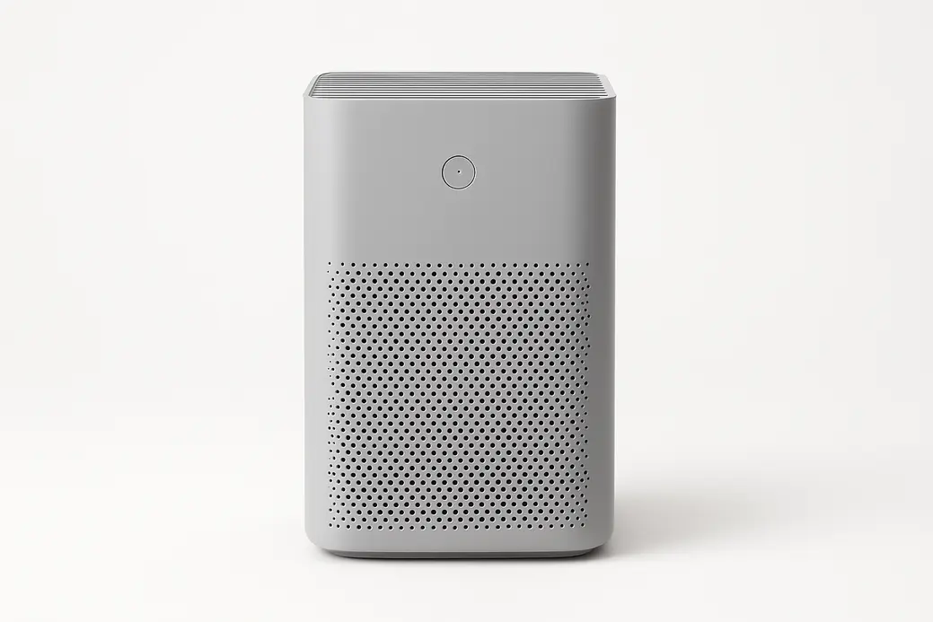 Professional product photo of a grey air purifier centered on a white background with soft even lighting and no visible text or logos.