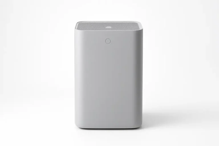Professional product photo of a gray air purifier, centered and fully visible on a white background with soft even lighting and no shadows or distractions