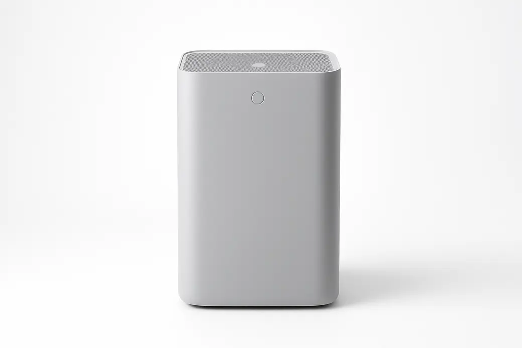 Professional product photo of a gray air purifier, centered and fully visible on a white background with soft even lighting and no shadows or distractions