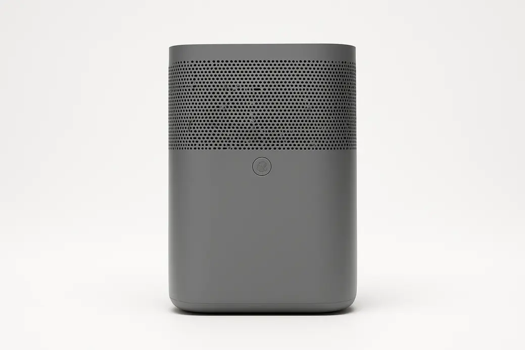 A clean, professional product photo of a centered grey air purifier on a white background with soft, even lighting and no text or branding.