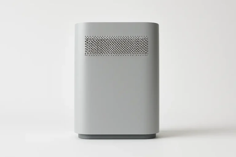 A clean, professional product photo of a single grey air purifier centered on a white background with soft, even lighting and no visible branding or text.