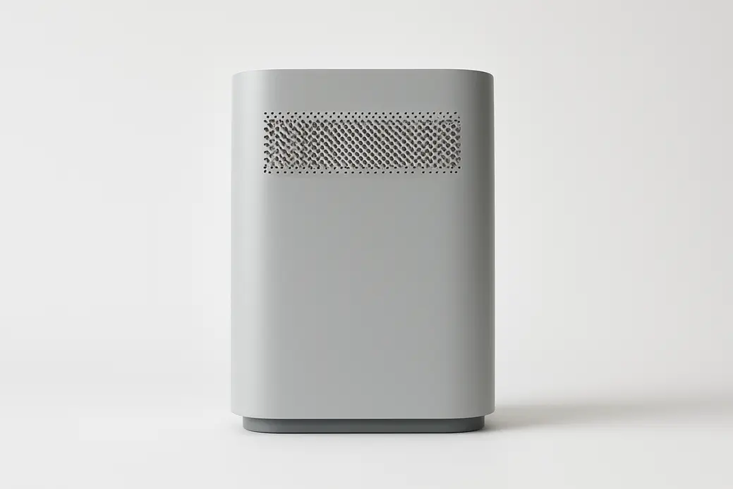 A clean, professional product photo of a single grey air purifier centered on a white background with soft, even lighting and no visible branding or text.