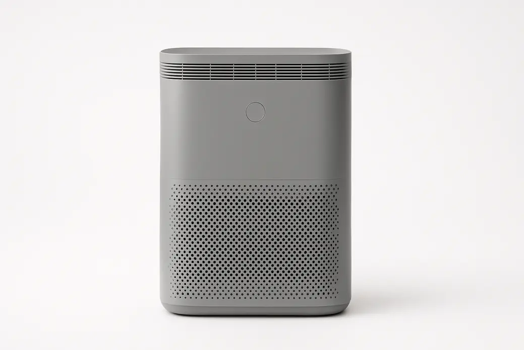 A grey air purifier centered on a clean white background with soft even lighting, fully visible and clearly showcasing the product design.