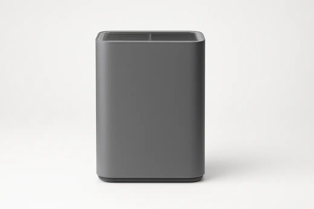Professional product photo of a single gray air purifier with a smooth matte finish, centered on a seamless white background, without any text or logos.